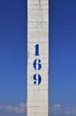 Number 169 printed on white wooden post in Copacabana beach, Rio