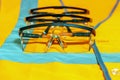 A number of protective glasses on an orange waistcoat with reflective strips. Royalty Free Stock Photo