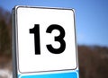 Number 13 in a road sign in mountain Royalty Free Stock Photo