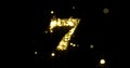 Number seven glitter gold. Golden glittering number 7 with glister light shiny sparks on black background