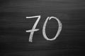Number seventy enumeration written with a chalk on the blackboard Royalty Free Stock Photo