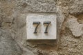 Number seventy seven on a wall