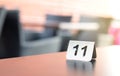 Number sign on restaurant table in outdoor terrace. Royalty Free Stock Photo