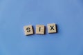 Number six laid out from tiles in words. Royalty Free Stock Photo