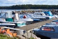 A number of small boats moored in the small harbor on the Baltic sea