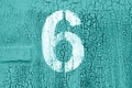 Number 6 in stencil on grungy metal wall in cyan tone Royalty Free Stock Photo