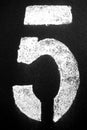 Number 5 in stencil on metal wall in black and white Royalty Free Stock Photo
