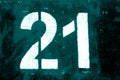 Number 21 in stencil on metal wall in cyan tone Royalty Free Stock Photo
