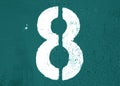 Number 8 in stencil on metal wall in cyan tone Royalty Free Stock Photo