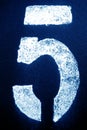 Number 5 in stencil on metal wall in navy blue tone Royalty Free Stock Photo