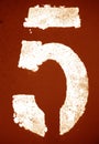 Number 5 in stencil on metal wall in orange tone Royalty Free Stock Photo