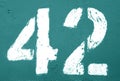 Number 42 in stencil on rusty metal wall in cyan tone Royalty Free Stock Photo