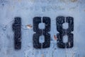 number 188 on a stone  wall Royalty Free Stock Photo