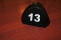 Number 13 table number on a wooden table Royalty Free Stock Photo