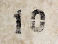 Number ten one zero 10 1 0 on concrete wall background Royalty Free Stock Photo