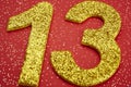 Number thirteen yellow color over a red background. Anniversary