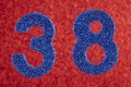 Number thirty-eight blue color over a red background. Anniversary