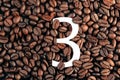 Number three on coffee bean background concept Royalty Free Stock Photo