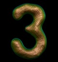 Number 3 three made of natural gold snake skin texture isolated on black Royalty Free Stock Photo