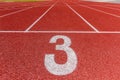 Number three on the running track Royalty Free Stock Photo