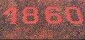 The number 1860 on the tiled roof of an old house, shown with red tiles Royalty Free Stock Photo