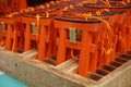 Number of tiny orange traditional Japanese gates (miniatures of Toriis) in the Shinto shrines