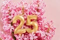 Number 25 twenty five golden celebration birthday candle on Festive Background. Royalty Free Stock Photo