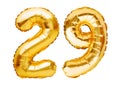 Number 29 twenty nine made of golden inflatable balloons isolated on white. Helium balloons, gold foil numbers. Party decoration, Royalty Free Stock Photo