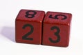 Number twenty three written on a red wooden cube of a calendar date Royalty Free Stock Photo