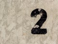 Number two 2 on concrete wall background Royalty Free Stock Photo