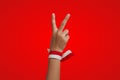 The number two finger and the red and white ribbon of the Indonesian flag, the concept of independence