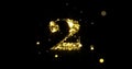 Number two glitter gold. Golden glittering number 2 with glister light shiny sparks on black background