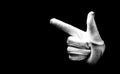 Number two 2 - a male hand wearing white glove isolated on black background. Hand gestures of pistol, gun Royalty Free Stock Photo