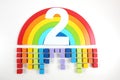 Number two with wooden toy rainbow and blocks of colorful rain. Royalty Free Stock Photo