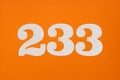 Number 233 - White digits on orange background