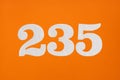 Number 235 - White digits on orange background