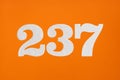 Number 237 - White digits on orange background Royalty Free Stock Photo