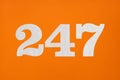 Number 247 - White digits on orange background