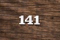 Number 141 in wood, isolated on rustic background