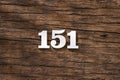 Number 151 in wood, isolated on rustic background Royalty Free Stock Photo
