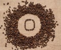 Numbers from coffee beans on burlap background Royalty Free Stock Photo