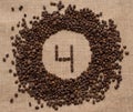 Numbers from coffee beans on burlap background Royalty Free Stock Photo