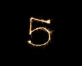 Numbers 5 or five Sparkler firework light isolated on black background Royalty Free Stock Photo