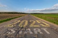 numbers 2025 go and start on asphalt road with cracks highway with sunrise or sunset sky background. concept of destination in Royalty Free Stock Photo