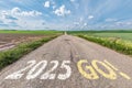 numbers 2025 go and start on asphalt road with cracks highway with sunrise or sunset sky background. concept of destination in Royalty Free Stock Photo