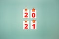 Numbers 2021 on a green background with decorations. New Year, Christmas concept. Flat lay