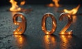 The numbers 902 are illuminated by warm orange light, casting reflection on dark surface with scattered Royalty Free Stock Photo