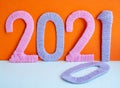 The numbers 2021 are made of pink and lilac threads on an orange background. The concept of a New year Royalty Free Stock Photo