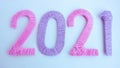 The numbers 2021 are made of pink and lilac threads on a white background. The concept of a New year Royalty Free Stock Photo