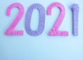 The numbers 2021 are made of pink and lilac threads on a white background. The concept of a New year Royalty Free Stock Photo